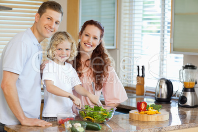 Family preparing salad