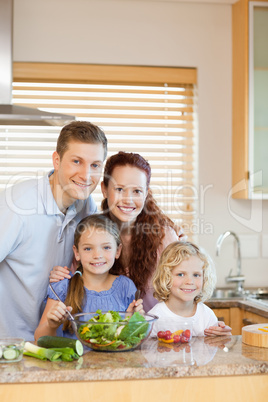 Family standing in the kitchen