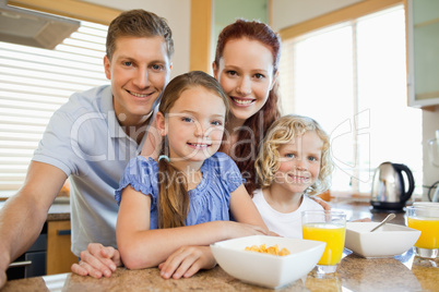 Family with breakfast in the kitchen