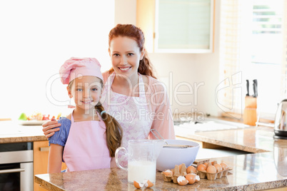 Mother and daughter preparing dough