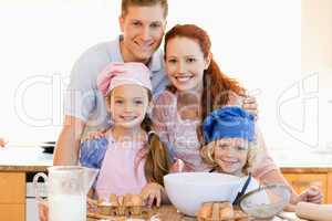 Family with baking ingredients in the kitchen