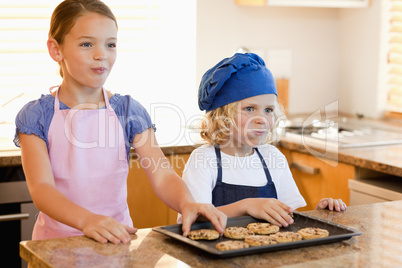 Siblings enjoying cookies together