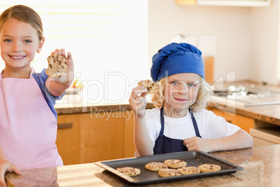 Siblings holding their cookies