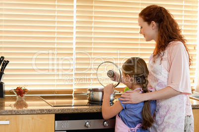 Mother and daughter cooking a meal