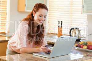 Woman entering credit card information