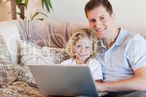 Father and son using notebook