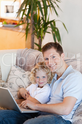 Father and son together with laptop