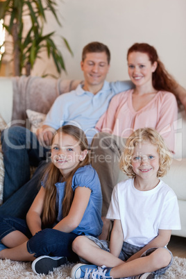 Happy family sitting in the living room