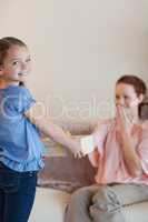 Little girl giving her mother a present