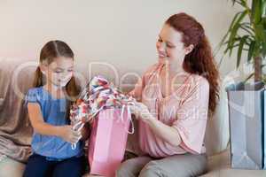 Mother and daughter looking at shopping