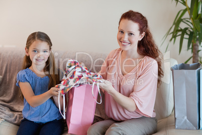 Mother and daughter with shopping