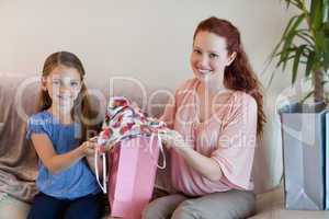 Mother and daughter with shopping