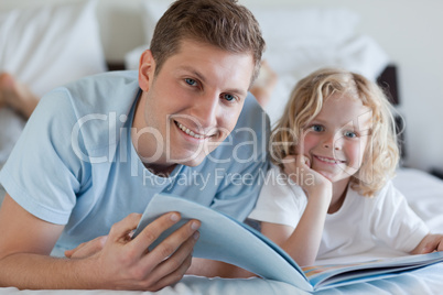 Father and son looking at magazine