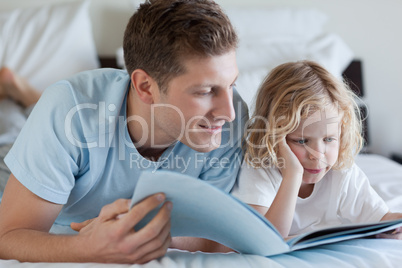 Father and son reading a magazine