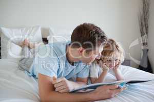 Father doing reading exercises with his son