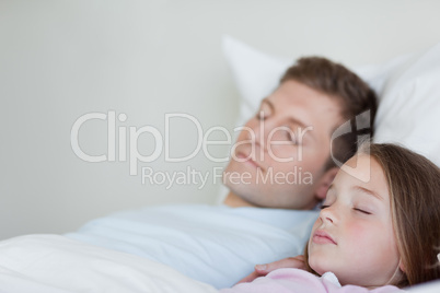 Side view of father and daughter asleep Side view of father and daughter asleep