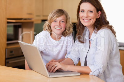 Mother and son with laptop