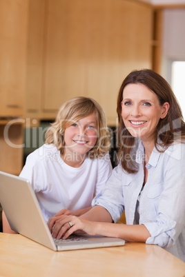 Mother and her son with laptop