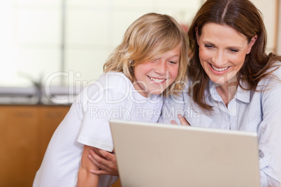 Woman and son with laptop