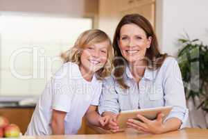 Woman and her son using tablet