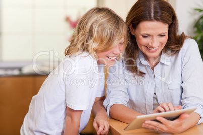 Mother and son using tablet
