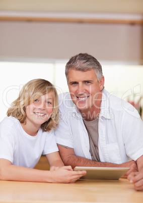 Man and his son using tablet