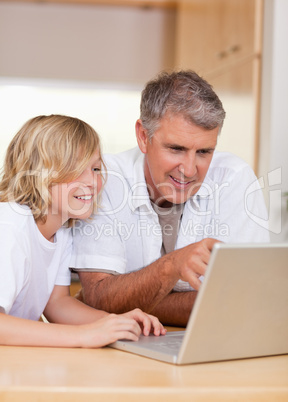 Father and son on the laptop