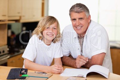 Man helping his son with homework