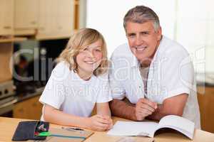Man helping his son with homework