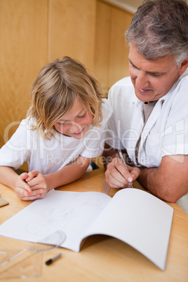 Man explaining homework to son