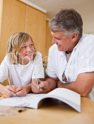 Male helping son with homework