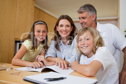 Parents helping children with homework