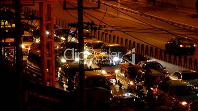 Many cars on overpass,traffic jam at night.