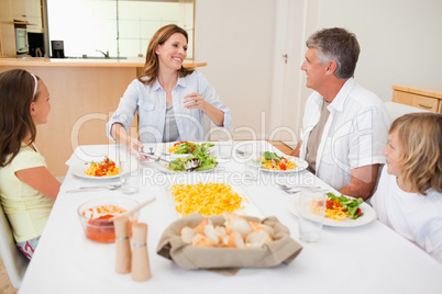Cheerful family at the dinner table