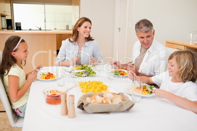 Family having a conversation while dinner