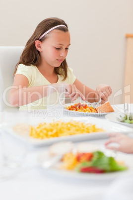 Girl eating at dinner table