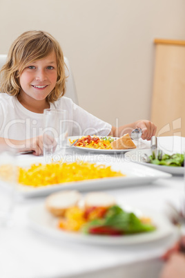 Boy sitting at dinner table