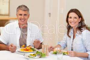 Smiling couple having dinner