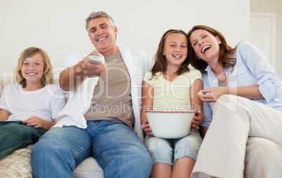 Family on the sofa watching tv