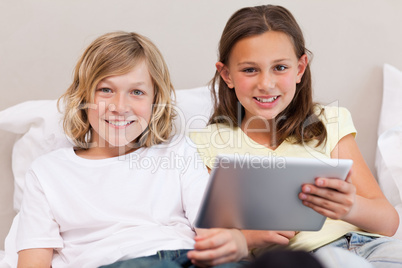 Brother and sister using tablet