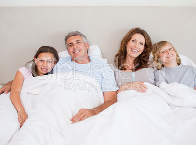Happy family about to take a nap
