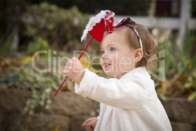 Adorable Baby Girl Playing in Park