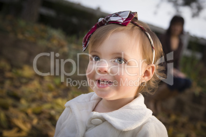 Adorable Baby Girl Playing in Park with Mom