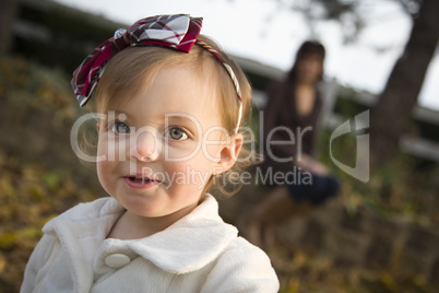 Adorable Baby Girl Playing in Park with Mom