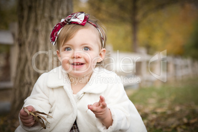 Adorable Baby Girl Playing in Park