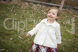 Adorable Baby Girl Playing in Park