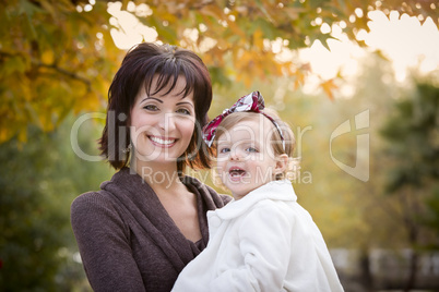 Attractive Mother and Daughter Portrait Outside