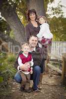 Young Attractive Parents and Children Portrait in Park