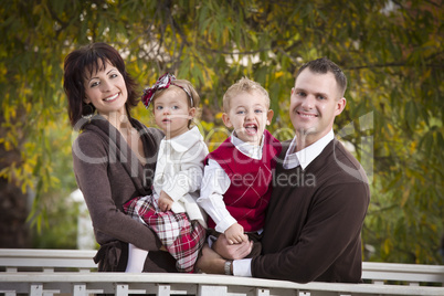 Young Attractive Parents and Children Portrait in Park