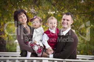 Young Attractive Parents and Children Portrait in Park